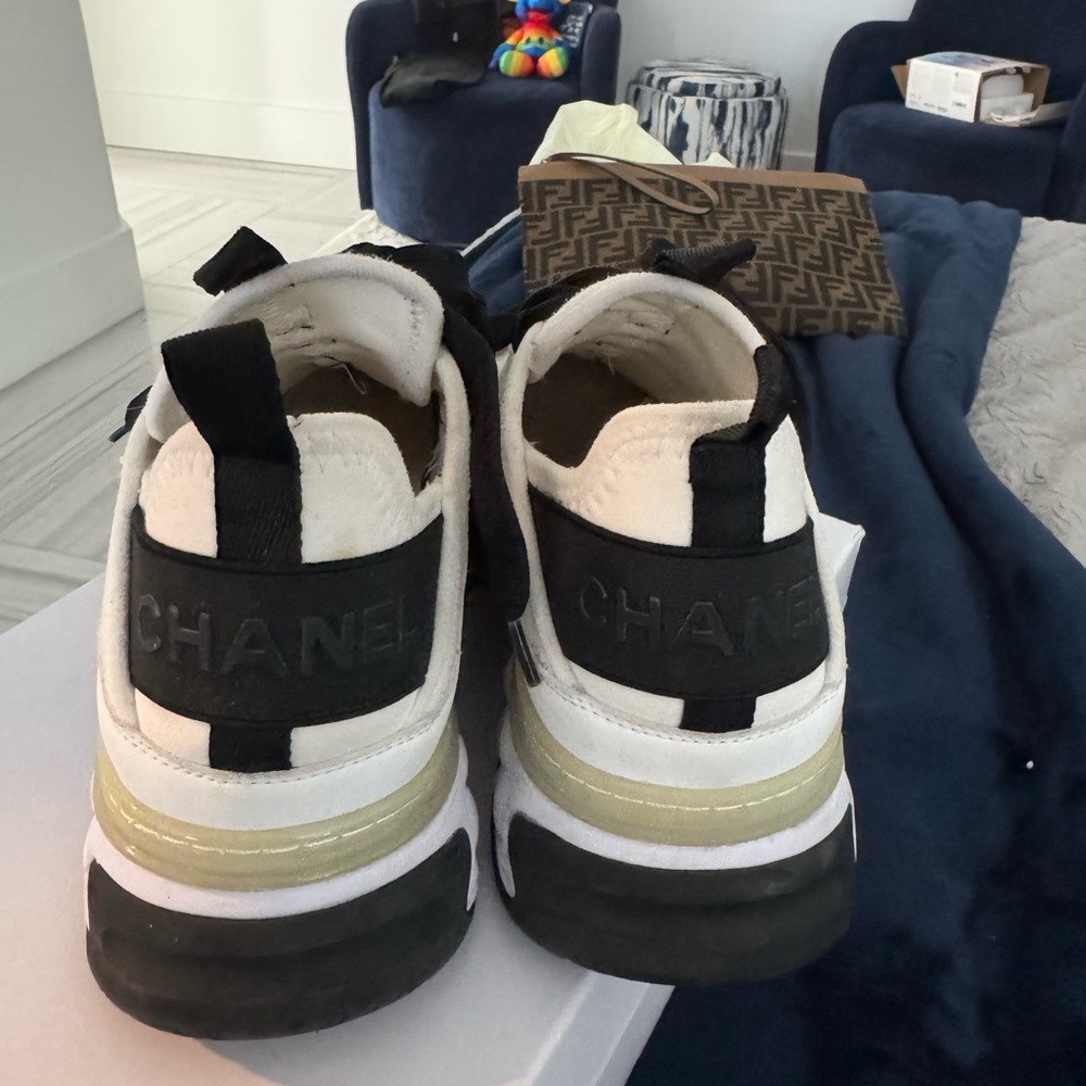 CHANEL White and Black Sneakers with Gold Accent - Picture 3 of 6